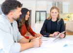 Insurance, finance or real estate agent with couple looking through documents. Business Contract Concept.
